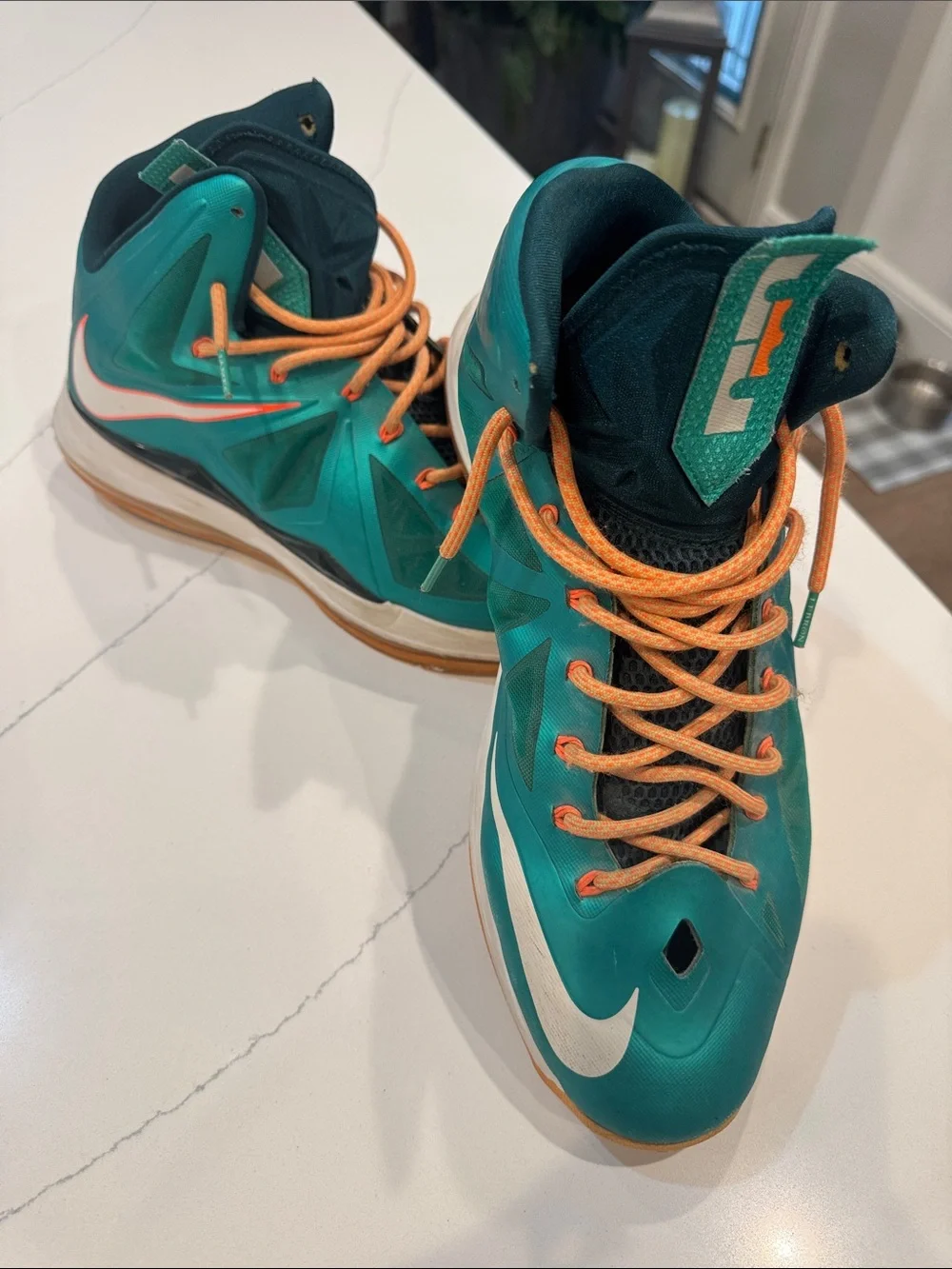 Nike Teal High-Top Basketball Sneakers with Orange Laces